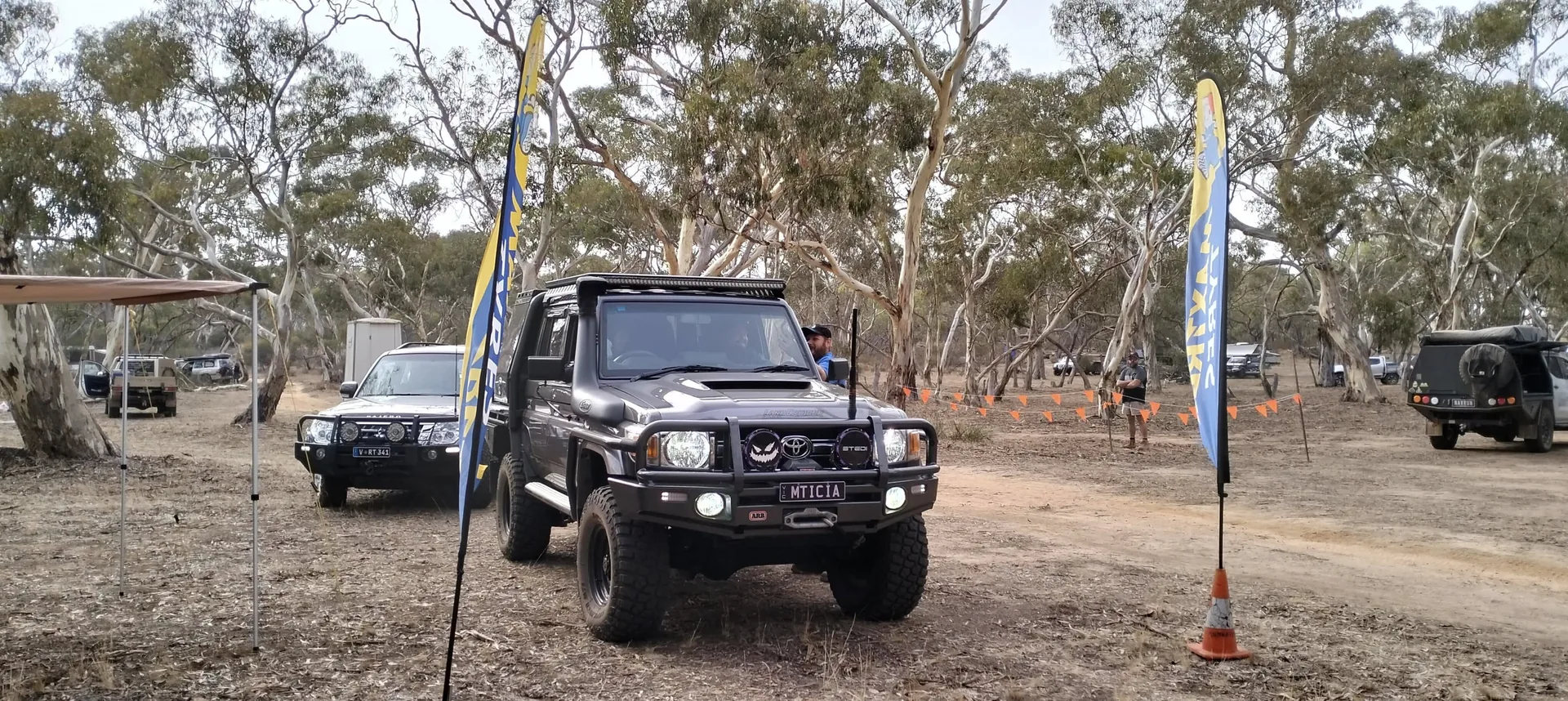 Land Cruiser rolling into base camp through the mallee scrub