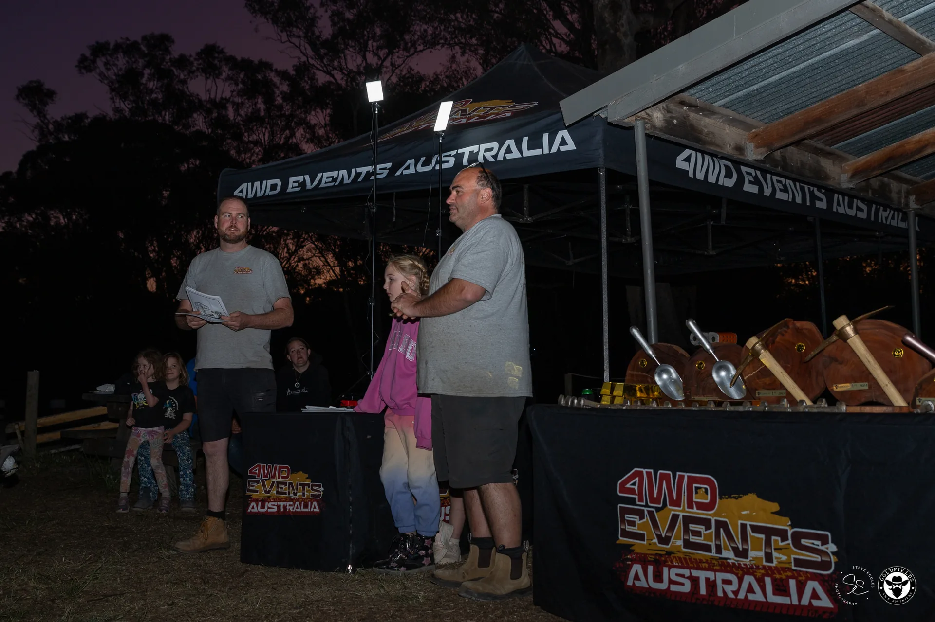 Competitor collecting trophy at Amazing Race Goldfields