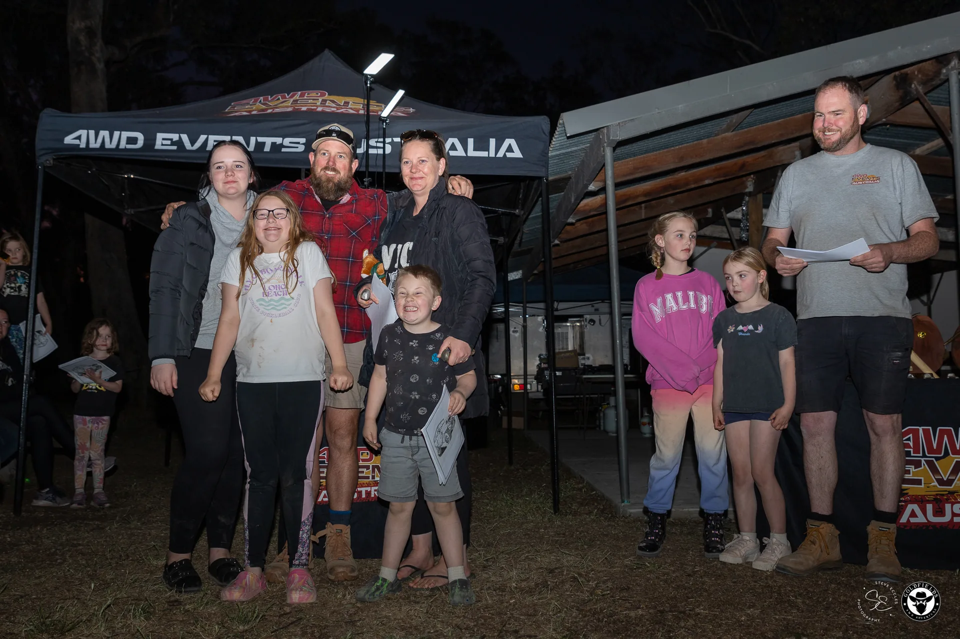 Family team collecting trophy at Amazing Race Goldfields presentation night